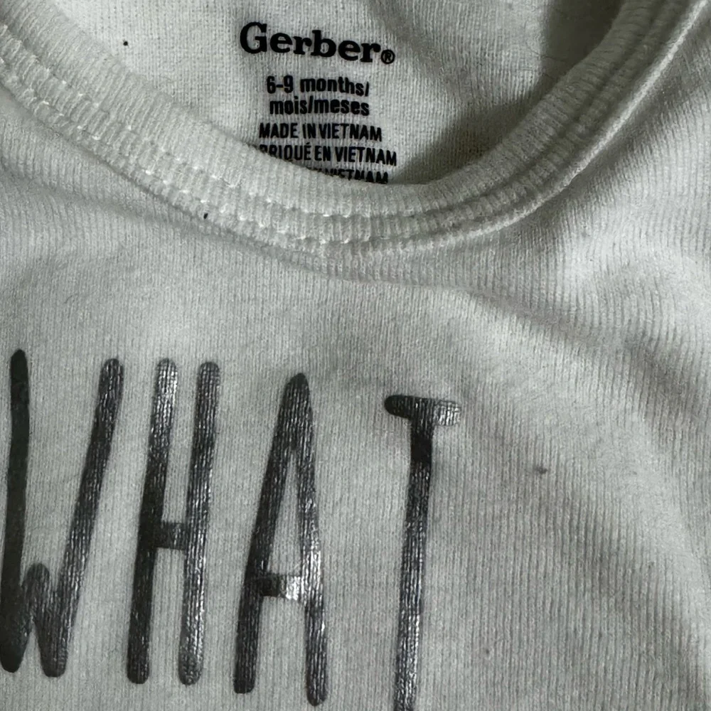 Gerber White Bodysuit with “What would Dolly Do”